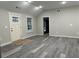 Spacious living area with gray vinyl flooring and neutral walls at 10033 Florence Cir, Villa Rica, GA 30180