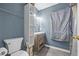 Bathroom with a toilet, vanity, and shelving unit at 145 Turning Pt, Stockbridge, GA 30281