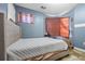 Spacious bedroom with a king-size bed and bay window at 145 Turning Pt, Stockbridge, GA 30281