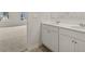 Bathroom with double vanity and neutral tile flooring at 37 Willow Green Trce, Dallas, GA 30157