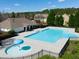 Community pool with a separate kiddie pool and clubhouse at 37 Willow Green Trce, Dallas, GA 30157