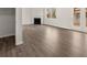 Gathering room with fireplace, hardwood floors, and access to backyard at 37 Willow Green Trce, Dallas, GA 30157