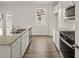 Bright kitchen featuring granite island and stainless steel appliances at 37 Willow Green Trce, Dallas, GA 30157