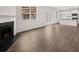 Open living room with hardwood floors, fireplace, and kitchen view at 37 Willow Green Trce, Dallas, GA 30157