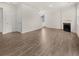 Spacious living room with hardwood floors and a corner fireplace at 37 Willow Green Trce, Dallas, GA 30157