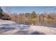 Peaceful lake view with snow covered shoreline at 605 Spruce Dr, Pine Lake, GA 30072