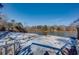 Snowy lakefront view with access and benches at 605 Spruce Dr, Pine Lake, GA 30072