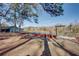 Picnic tables by the lake with a pergola at 605 Spruce Dr, Pine Lake, GA 30072