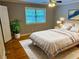 Bright bedroom with a white bed, gray walls, and hardwood floors at 1683 Briarcliff Ne Rd # 4, Atlanta, GA 30306
