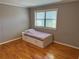 Bright bedroom with hardwood floors and a twin-size bed at 1683 Briarcliff Ne Rd # 4, Atlanta, GA 30306