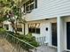 White exterior of a townhouse with dark gray door, landscaping, and a walkway at 1683 Briarcliff Ne Rd # 4, Atlanta, GA 30306