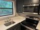 Modern kitchen with stainless steel appliances and white countertops at 1683 Briarcliff Ne Rd # 4, Atlanta, GA 30306