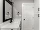 Clean bathroom with a white vanity and a large mirror at 2253 Bonnybrook Sw Way, Atlanta, GA 30311