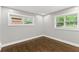 Spacious bedroom with hardwood floors and two windows at 2253 Bonnybrook Sw Way, Atlanta, GA 30311