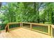 New deck overlooks a private backyard with lush trees at 2253 Bonnybrook Sw Way, Atlanta, GA 30311