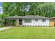 Charming ranch home with white brick exterior, updated landscaping, and a spacious yard at 2253 Bonnybrook Sw Way, Atlanta, GA 30311