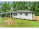 Newly renovated ranch home with white brick exterior and modern black window frames at 2253 Bonnybrook Sw Way, Atlanta, GA 30311