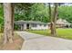 Newly renovated ranch home with a landscaped yard and driveway at 2253 Bonnybrook Sw Way, Atlanta, GA 30311