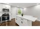 Modern kitchen with white cabinets and quartz countertops at 2253 Bonnybrook Sw Way, Atlanta, GA 30311