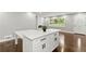 Modern kitchen with white cabinets and a large island at 2253 Bonnybrook Sw Way, Atlanta, GA 30311