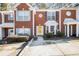 Brick townhouse exterior with landscaped front yard and driveway at 2654 Parkway Trl, Lithonia, GA 30058