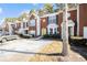 Brick townhouse exterior with parking and mature trees at 2654 Parkway Trl, Lithonia, GA 30058