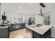 Modern kitchen with white and gray cabinets and quartz countertops at 3214 Cedar Bluff Ne Dr, Marietta, GA 30062