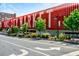 Exterior view of Ponce City Market building, showing its unique architecture and landscaping at 795 Ponce De Leon Ne Pl # C3, Atlanta, GA 30306