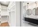 Modern bathroom with double vanity and walk-in closet at 192 East Lake Se Ter, Atlanta, GA 30317