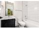 Modern bathroom with white subway tile and black vanity at 192 East Lake Se Ter, Atlanta, GA 30317