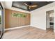 Modern bedroom with wood slat accent wall and hardwood floors at 192 East Lake Se Ter, Atlanta, GA 30317