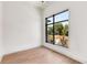 Light-filled bedroom with hardwood floors and large window at 192 East Lake Se Ter, Atlanta, GA 30317