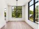 Light-filled dining room with hardwood floors and large windows at 192 East Lake Se Ter, Atlanta, GA 30317