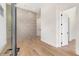 Light-filled foyer with geometric wall accents and hardwood floors at 192 East Lake Se Ter, Atlanta, GA 30317