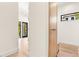 Clean hallway with light walls, hardwood floors and built-in storage at 192 East Lake Se Ter, Atlanta, GA 30317