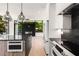 Modern kitchen with island, microwave drawer, and stainless steel appliances at 192 East Lake Se Ter, Atlanta, GA 30317