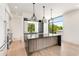 Modern kitchen with a large island, dark countertops, and stainless steel appliances at 192 East Lake Se Ter, Atlanta, GA 30317