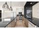 Modern kitchen with dark countertops, stainless steel appliances, and wood cabinets at 192 East Lake Se Ter, Atlanta, GA 30317
