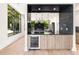 Modern kitchen with breakfast bar, wine cooler, and dark countertops at 192 East Lake Se Ter, Atlanta, GA 30317