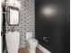 Stylish powder room with geometric tile and modern vanity at 192 East Lake Se Ter, Atlanta, GA 30317