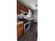 The kitchen features stainless steel appliances and dark wood cabinets at 2115 Charter Ln, Lithonia, GA 30058