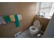 Small bathroom with toilet and updated sink at 633 Duncan Rd, Oxford, GA 30054