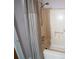 Small bathroom with shower and tub at 633 Duncan Rd, Oxford, GA 30054