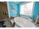 Large bathroom with a garden tub and double vanity at 633 Duncan Rd, Oxford, GA 30054