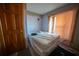 Simple bedroom with wood floors and new paint at 633 Duncan Rd, Oxford, GA 30054