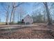Rear view of house with large backyard and basketball court at 633 Duncan Rd, Oxford, GA 30054