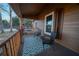 Relaxing front porch with seating and geometric rug at 633 Duncan Rd, Oxford, GA 30054