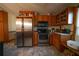 Kitchen boasts stainless steel appliances and wood cabinets at 633 Duncan Rd, Oxford, GA 30054