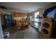 Kitchen with wood cabinets, a refrigerator, and a fish tank at 633 Duncan Rd, Oxford, GA 30054