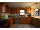 Kitchen with wood cabinets, stainless steel appliances, and tile floor at 633 Duncan Rd, Oxford, GA 30054